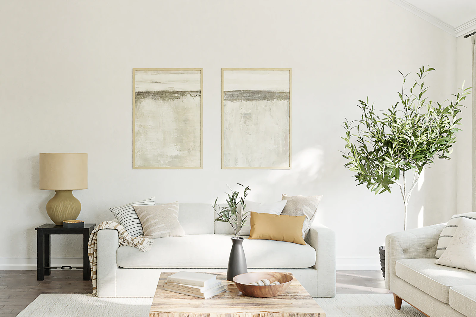 A bright, carefully kept living room with a linen sofa, framed prints and an olive tree by the window